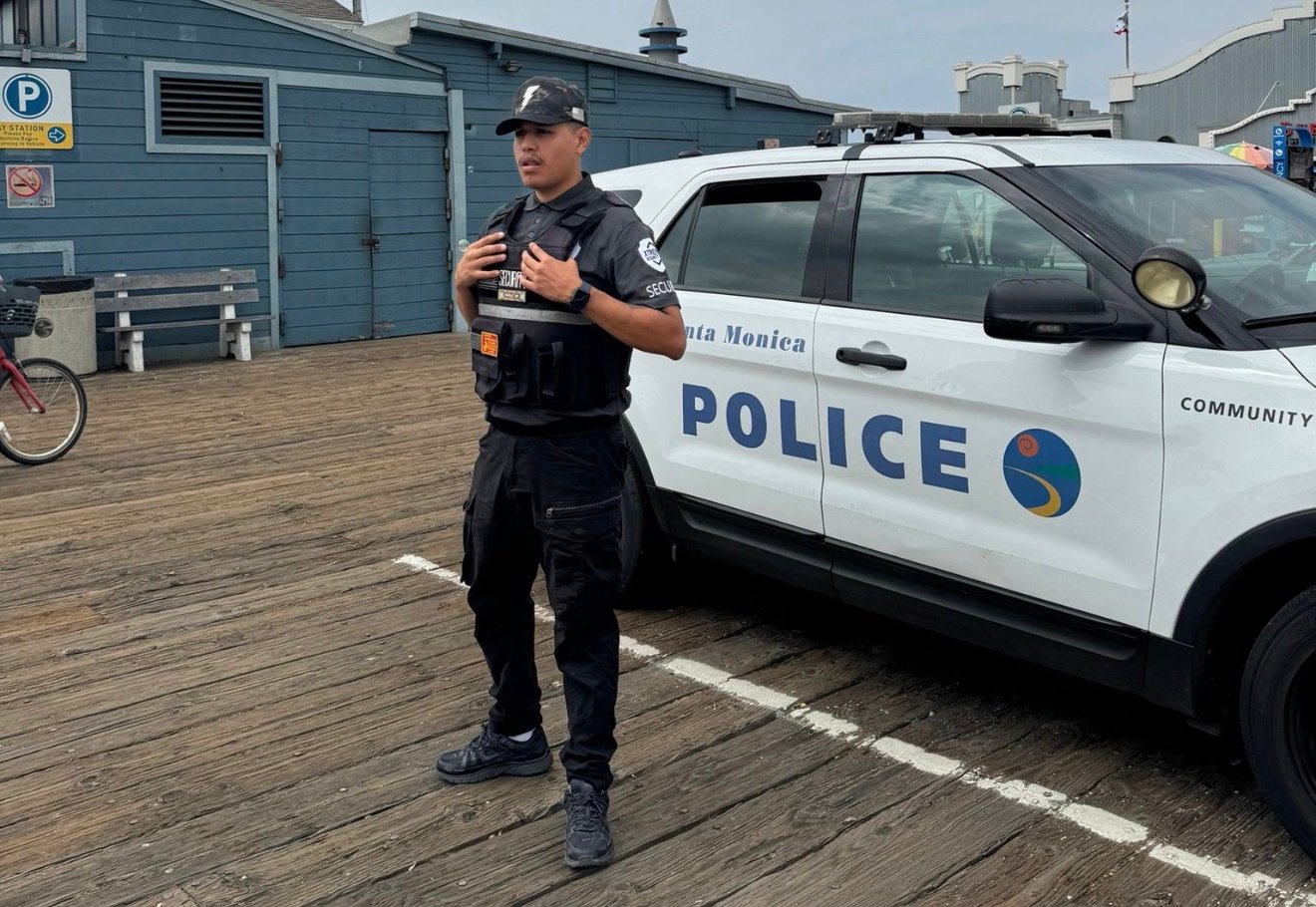 Xtreme Security guard on duty at Santa Monica Pier, California