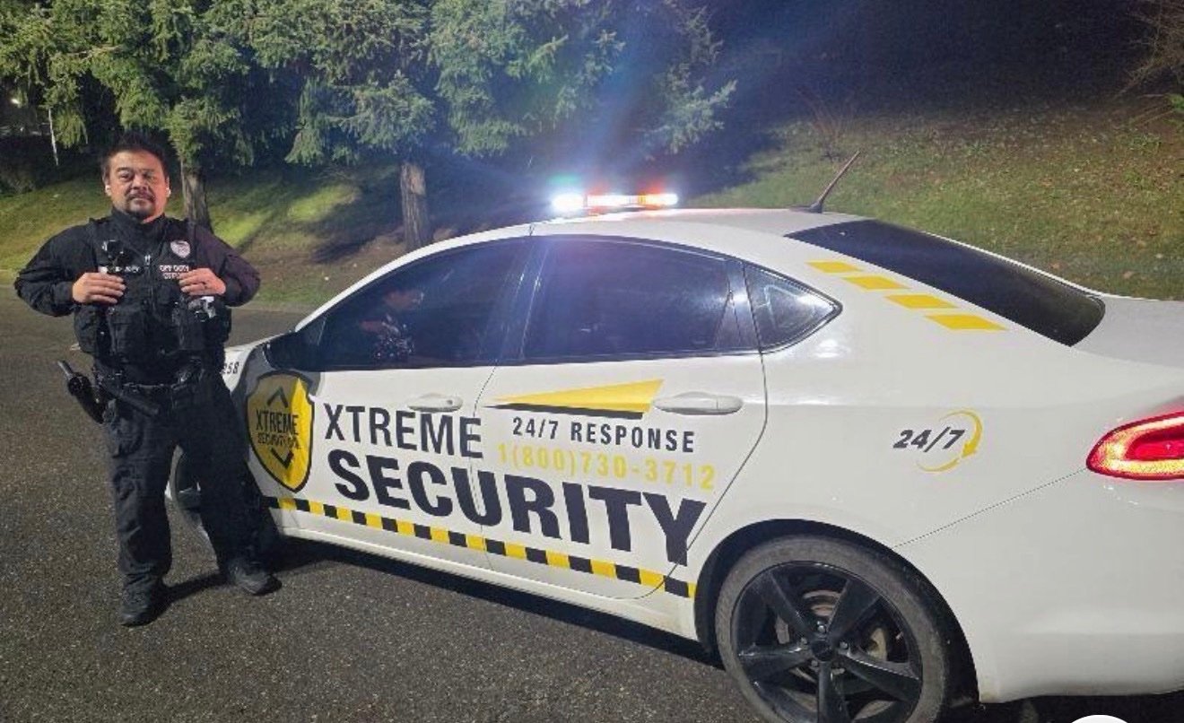 Xtreme Security marked patrol car with 24/7 response branding